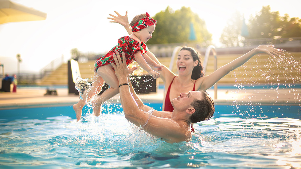 family in pool slide 980x550 85